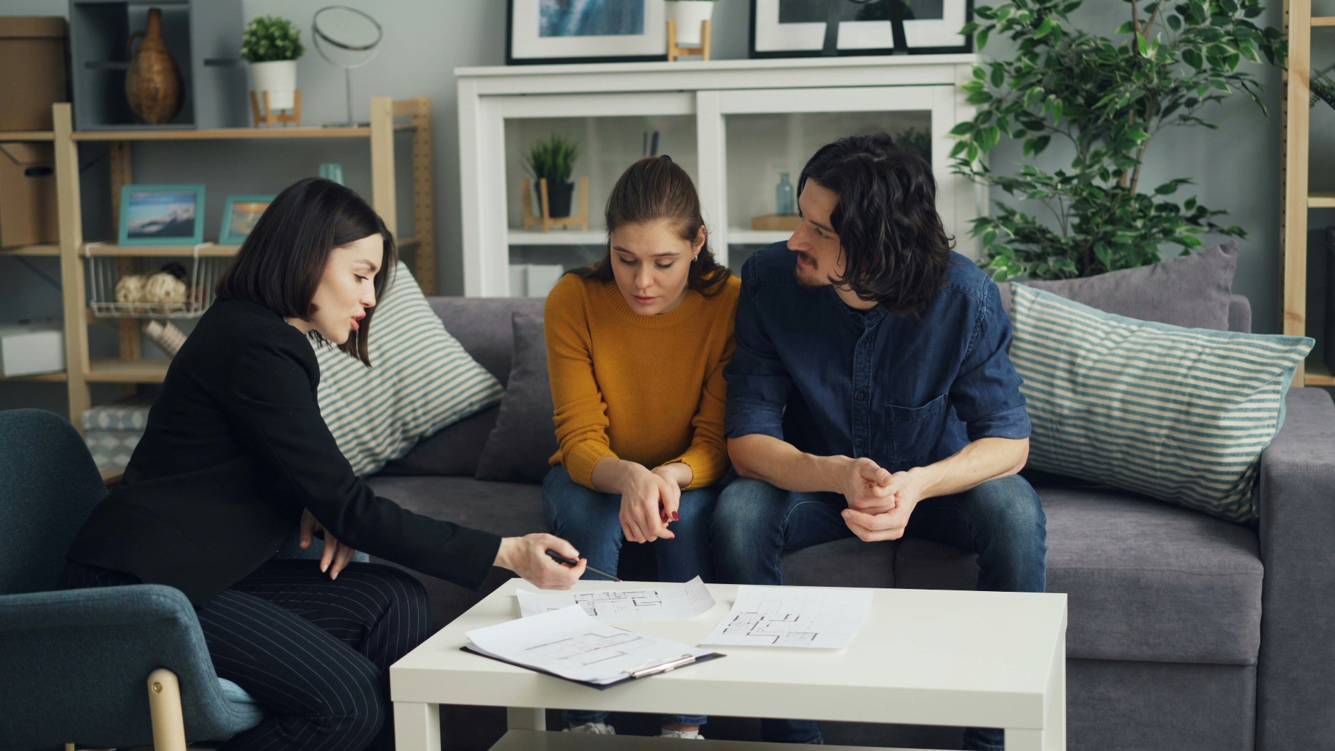 Friendly financial advisor meeting with clients over property plans